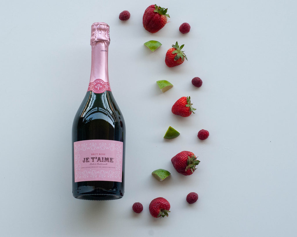 Visual wine tasting notes for Je T'aime Brut Sparkling Rosé - bottle of wine with strawberry, raspberry, and lime